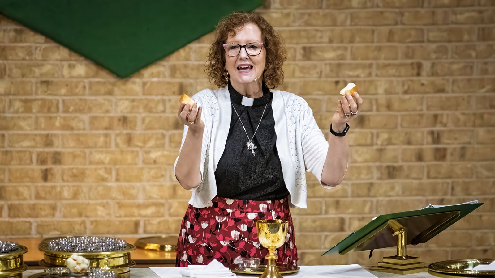 Pastor Linda at the communion table