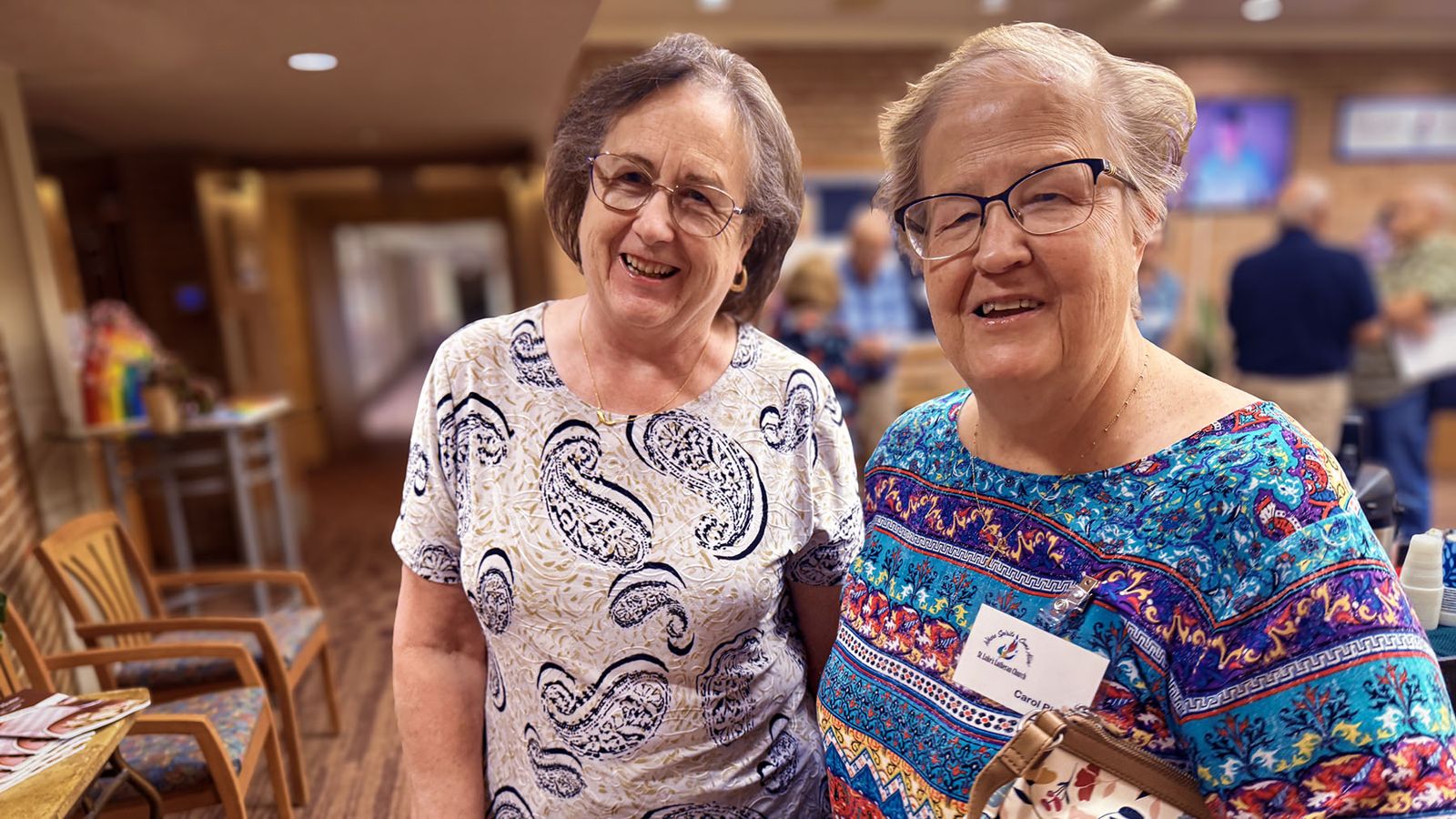 Two members catching up after worship